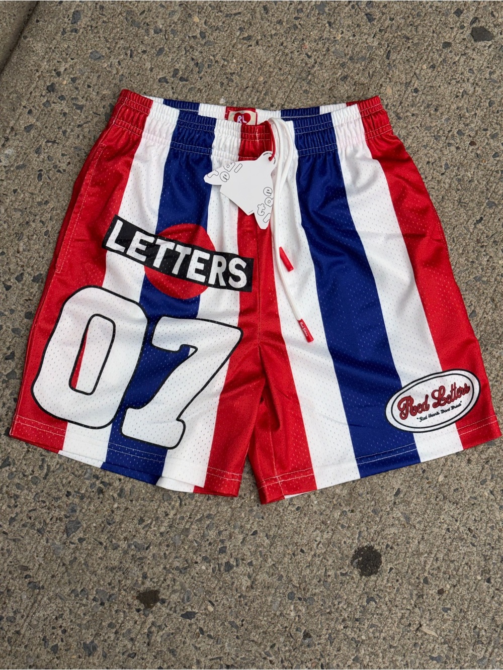 Red letters striped mesh shorts size small NWT